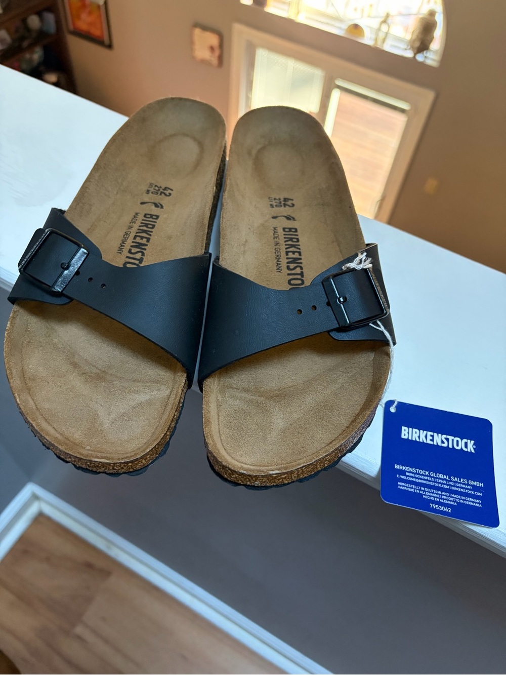 Birkenstock Single Strap Sandals in Black with Tan Footbed